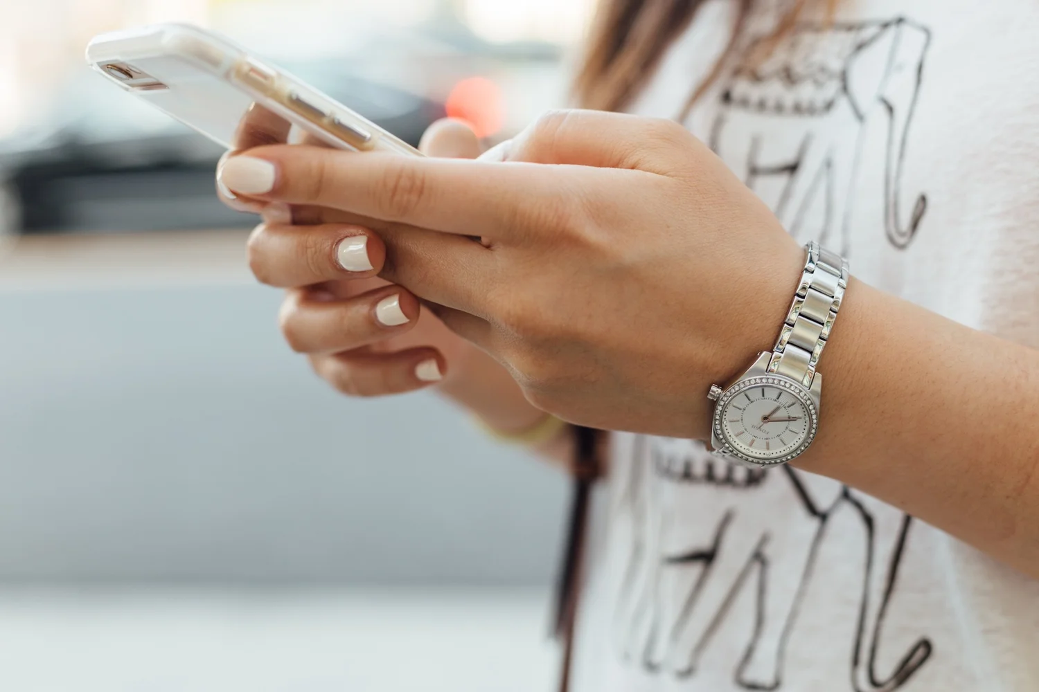 A teen holding a phone