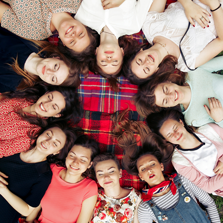 Teen girls lying in a circle